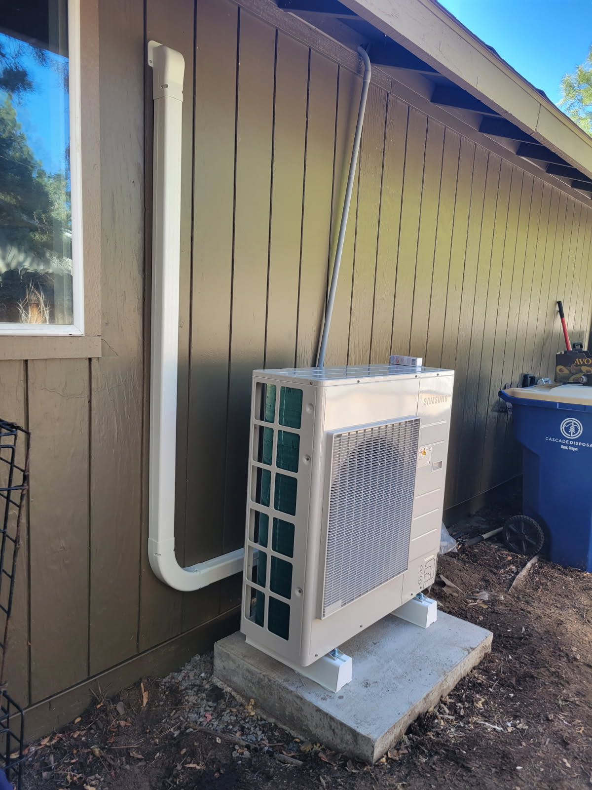 Ductless mini-split outdoor condenser neatly installed beside a home in Bend, Oregon